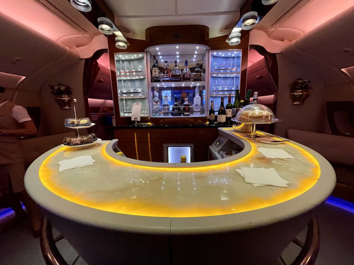 Which airlines (and on which planes) have passenger bars, and the rules for going there